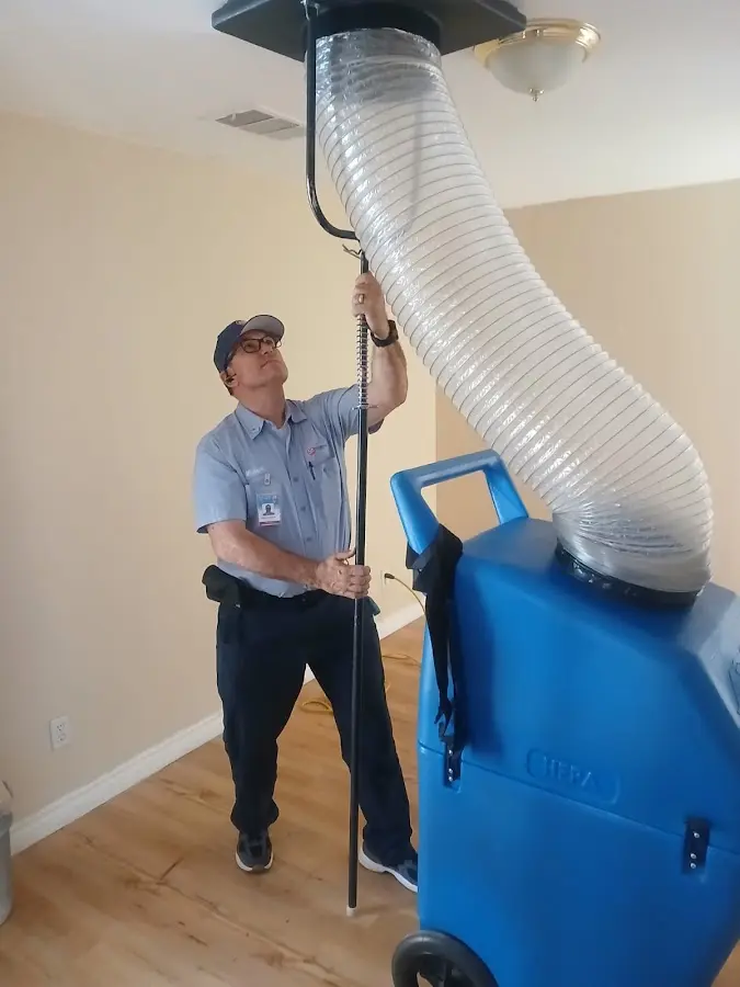 HVAC Installation technician using HEPA equipment in Clute